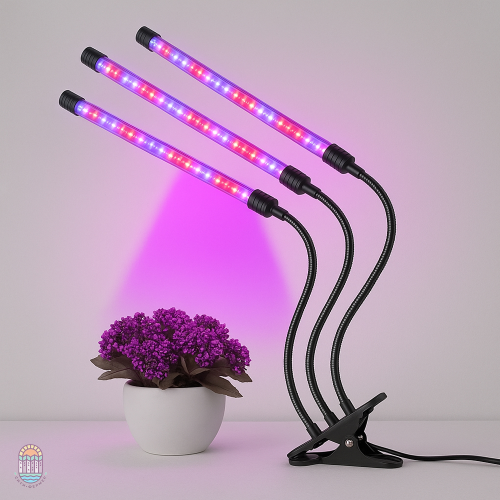 фиолетовый фитосветильник над растенияем