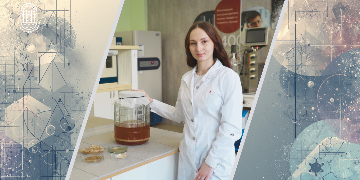 Молодая женщина учёный в белом халате стоит в лаборатории. Рядом на столе стоит большая банка с чайным грибом и лежат образцы в чашках Петри